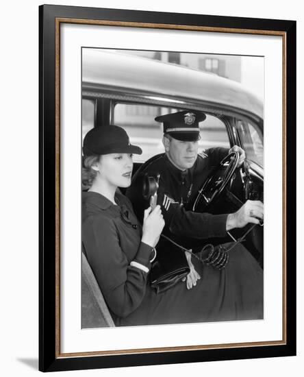 Woman Using Radio in Car with Policeman-null-Framed Photo