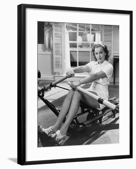 Woman Using Rowing Machine-null-Framed Photo