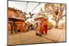 Woman walking and praying with pigeons at the hilltop temple, Bhaktapur, Kathmandu Valley, Nepal, A-Laura Grier-Mounted Photographic Print