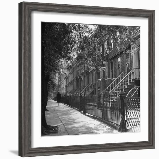 Woman Walking Down Street in Front of Apartment Buildings-Ed Clark-Framed Photographic Print