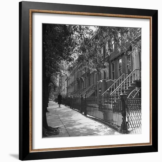 Woman Walking Down Street in Front of Apartment Buildings-Ed Clark-Framed Photographic Print