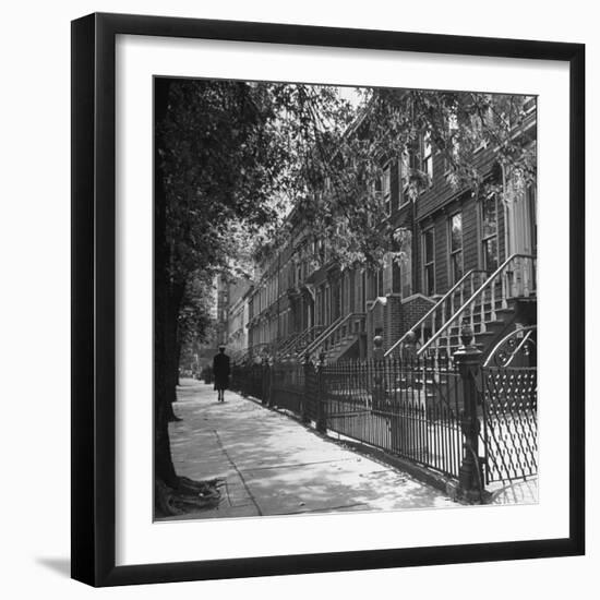 Woman Walking Down Street in Front of Apartment Buildings-Ed Clark-Framed Photographic Print