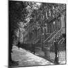 Woman Walking Down Street in Front of Apartment Buildings-Ed Clark-Mounted Photographic Print