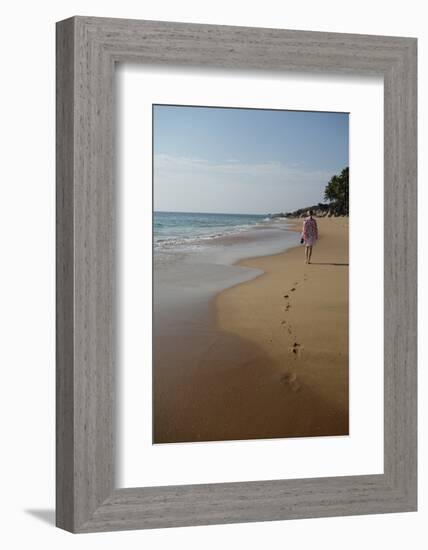 Woman Walking Leaving Footprints on Deserted Beach, Niraamaya, Kovalam, Kerala, India, Asia-James Strachan-Framed Photographic Print