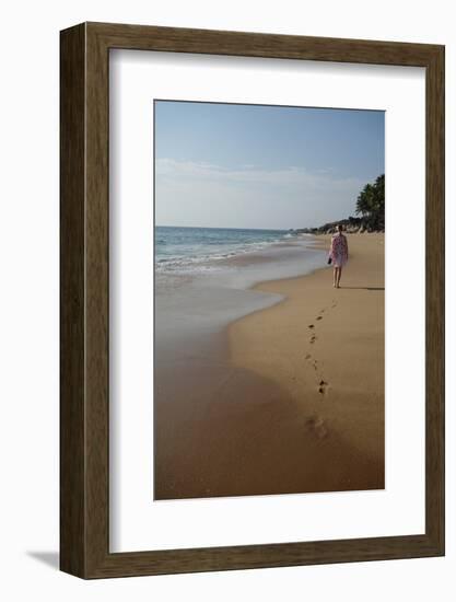 Woman Walking Leaving Footprints on Deserted Beach, Niraamaya, Kovalam, Kerala, India, Asia-James Strachan-Framed Photographic Print