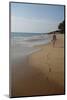 Woman Walking Leaving Footprints on Deserted Beach, Niraamaya, Kovalam, Kerala, India, Asia-James Strachan-Mounted Photographic Print