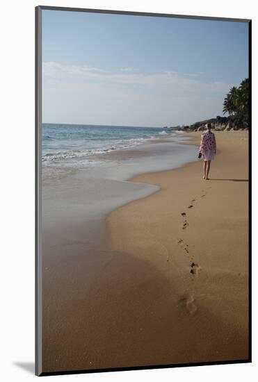 Woman Walking Leaving Footprints on Deserted Beach, Niraamaya, Kovalam, Kerala, India, Asia-James Strachan-Mounted Photographic Print