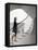 Woman walking up staircase holding handrail-John Edward Linden-Framed Stretched Canvas