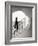 Woman walking up staircase holding handrail-John Edward Linden-Framed Photo