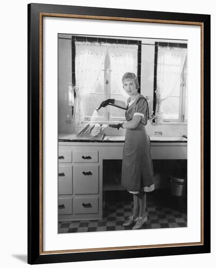 Woman Washing Dishes-null-Framed Photo