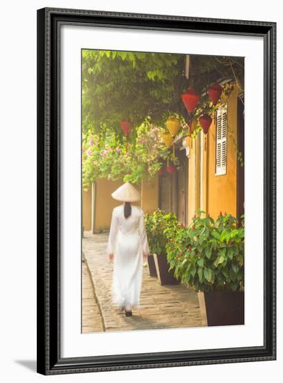 Woman Wearing Ao Dai Dress Walking Along Street, Hoi An, Quang Ham, Vietnam-Ian Trower-Framed Photographic Print