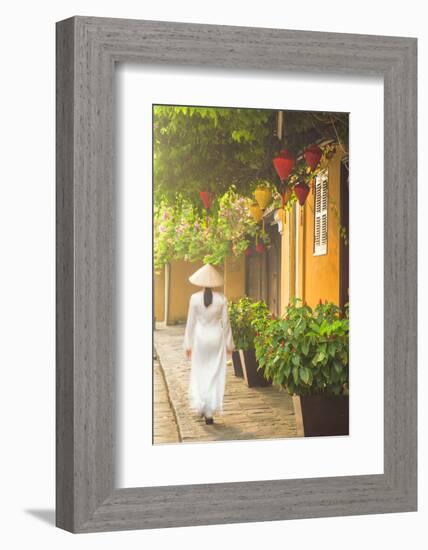 Woman Wearing Ao Dai Dress Walking Along Street, Hoi An, Quang Ham, Vietnam-Ian Trower-Framed Photographic Print