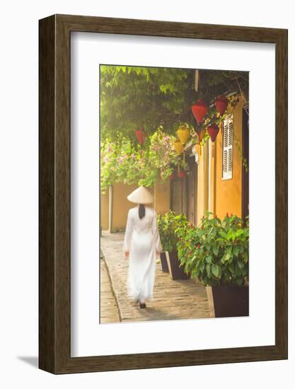 Woman Wearing Ao Dai Dress Walking Along Street, Hoi An, Quang Ham, Vietnam-Ian Trower-Framed Photographic Print