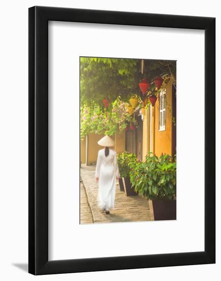 Woman Wearing Ao Dai Dress Walking Along Street, Hoi An, Quang Ham, Vietnam-Ian Trower-Framed Photographic Print