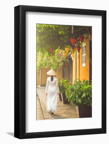 Woman Wearing Ao Dai Dress Walking Along Street, Hoi An, Quang Ham, Vietnam-Ian Trower-Framed Photographic Print