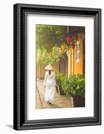 Woman Wearing Ao Dai Dress Walking Along Street, Hoi An, Quang Ham, Vietnam-Ian Trower-Framed Photographic Print