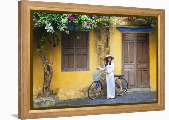 Woman Wearing Ao Dai Dress with Bicycle, Hoi An, Quang Ham, Vietnam-Ian Trower-Framed Premier Image Canvas