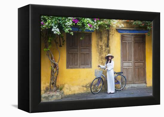 Woman Wearing Ao Dai Dress with Bicycle, Hoi An, Quang Ham, Vietnam-Ian Trower-Framed Premier Image Canvas