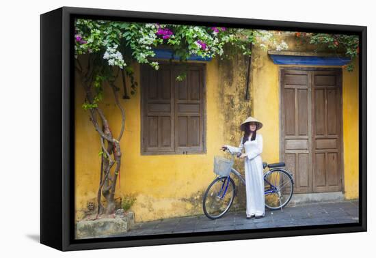 Woman Wearing Ao Dai Dress with Bicycle, Hoi An, Quang Ham, Vietnam-Ian Trower-Framed Premier Image Canvas