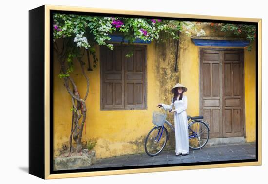 Woman Wearing Ao Dai Dress with Bicycle, Hoi An, Quang Ham, Vietnam-Ian Trower-Framed Premier Image Canvas