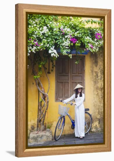 Woman Wearing Ao Dai Dress with Bicycle, Hoi An, Quang Ham, Vietnam-Ian Trower-Framed Premier Image Canvas