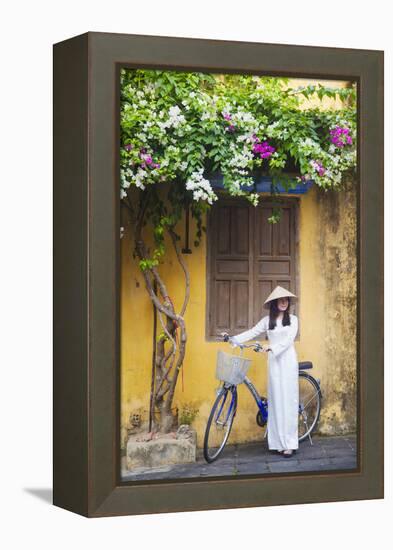 Woman Wearing Ao Dai Dress with Bicycle, Hoi An, Quang Ham, Vietnam-Ian Trower-Framed Premier Image Canvas