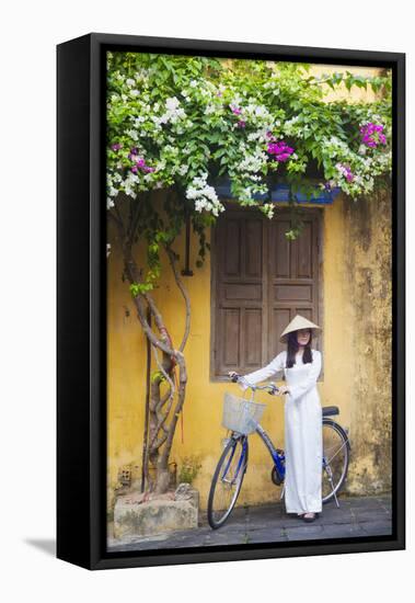 Woman Wearing Ao Dai Dress with Bicycle, Hoi An, Quang Ham, Vietnam-Ian Trower-Framed Premier Image Canvas