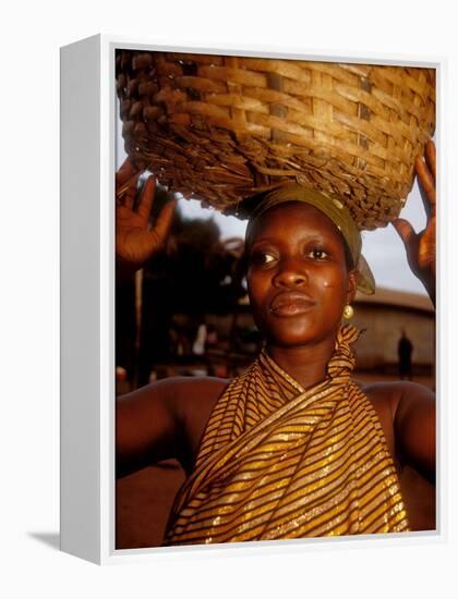 Woman Wearing Gold Fabric Dress and Carrying Basket, Kabile, Brong-Ahafo Region, Ghana-Alison Jones-Framed Premier Image Canvas