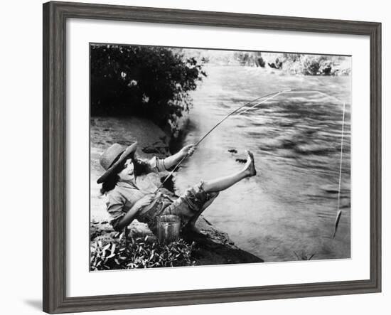 Woman Who Caught a Small Fish Falling over Backwards-null-Framed Photo