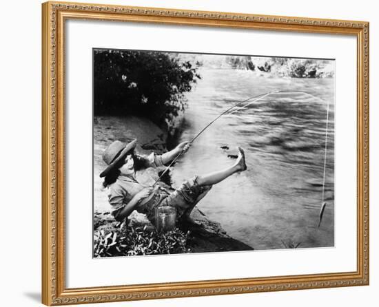 Woman Who Caught a Small Fish Falling over Backwards-null-Framed Photo