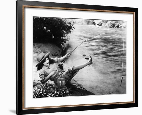 Woman Who Caught a Small Fish Falling over Backwards-null-Framed Photo