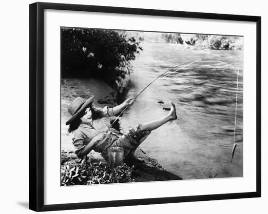 Woman Who Caught a Small Fish Falling over Backwards-null-Framed Photo