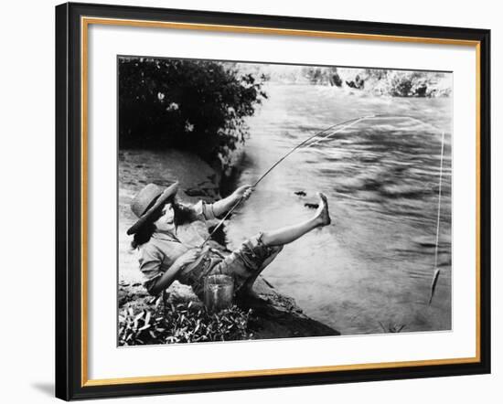 Woman Who Caught a Small Fish Falling over Backwards-null-Framed Photo