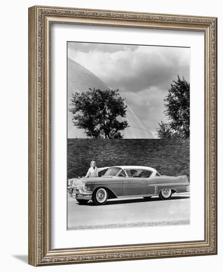 Woman with a 1957 Cadillac Coupe De Ville-null-Framed Photographic Print