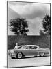 Woman with a 1957 Cadillac Coupe De Ville-null-Mounted Photographic Print