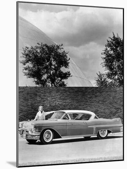 Woman with a 1957 Cadillac Coupe De Ville-null-Mounted Photographic Print