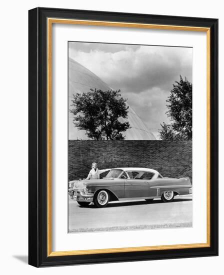 Woman with a 1957 Cadillac Coupe De Ville-null-Framed Photographic Print