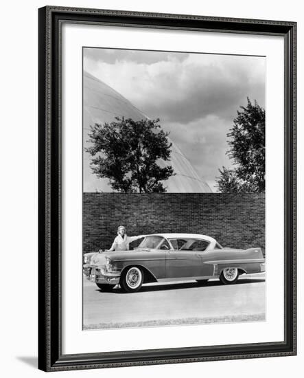 Woman with a 1957 Cadillac Coupe De Ville-null-Framed Photographic Print