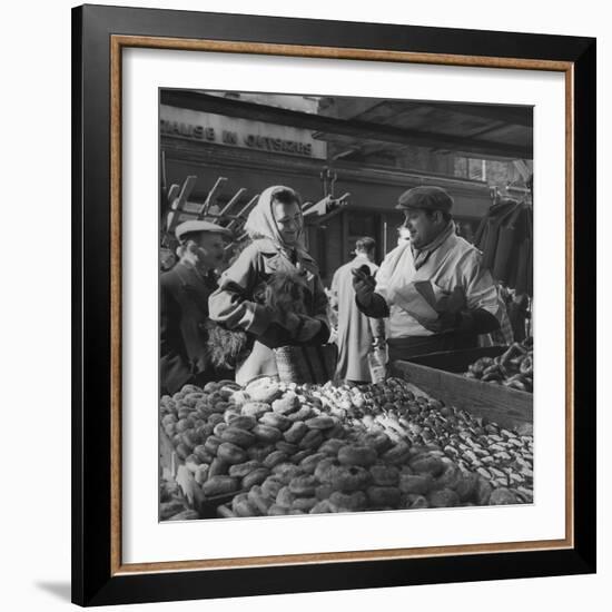 Woman with a Small Terrier Buying Bagels at a Market Stall, Possibly London, C.1945-50-null-Framed Giclee Print