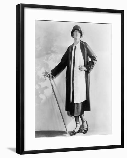 Woman with a Walking Stick in an Elegant Dress and Coat-null-Framed Photo