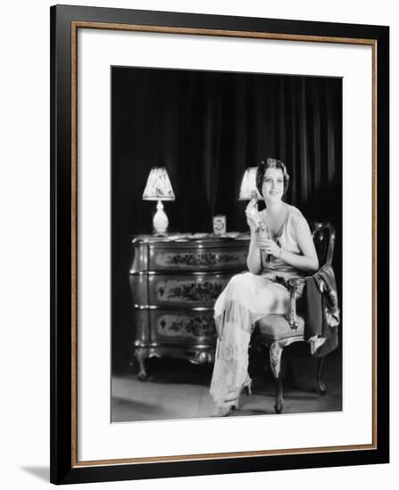 Woman with Bottle of Perfume-null-Framed Photo