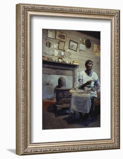 Woman with Cotton Stalks Beside a Wood-Burning Stove, Edisto Island, South Carolina, 1956-Walter Sanders-Framed Photographic Print