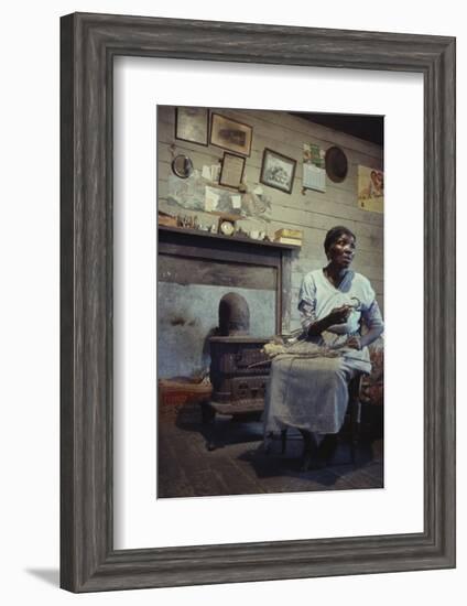 Woman with Cotton Stalks Beside a Wood-Burning Stove, Edisto Island, South Carolina, 1956-Walter Sanders-Framed Photographic Print