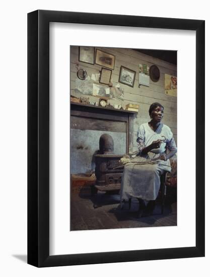 Woman with Cotton Stalks Beside a Wood-Burning Stove, Edisto Island, South Carolina, 1956-Walter Sanders-Framed Photographic Print