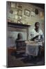 Woman with Cotton Stalks Beside a Wood-Burning Stove, Edisto Island, South Carolina, 1956-Walter Sanders-Mounted Photographic Print