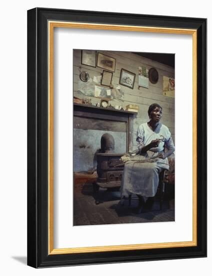 Woman with Cotton Stalks Beside a Wood-Burning Stove, Edisto Island, South Carolina, 1956-Walter Sanders-Framed Photographic Print