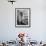 Woman with Large Stove Holding Pan-null-Framed Photo displayed on a wall