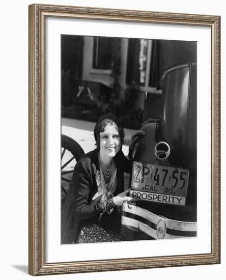 Woman with Prosperity Sign on Car Bumper-null-Framed Photo