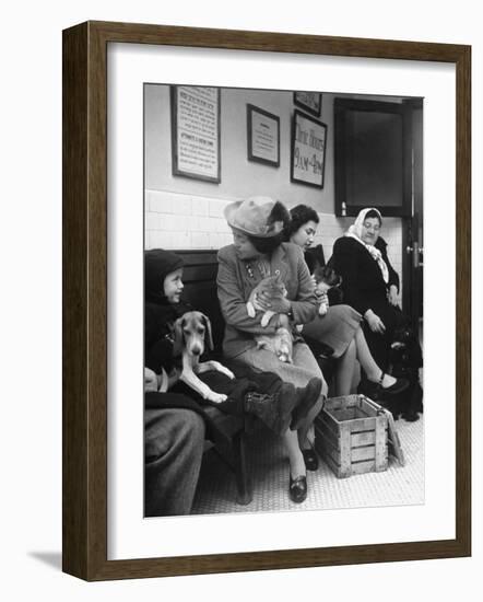 Women and Children Holding Pets While Waiting to See Veterinarian-Nina Leen-Framed Photographic Print