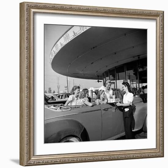 Women and Girls, in Convertible at Drive In, Greet Female Car Hop, Who Just Brought Their Drinks-Nina Leen-Framed Photographic Print